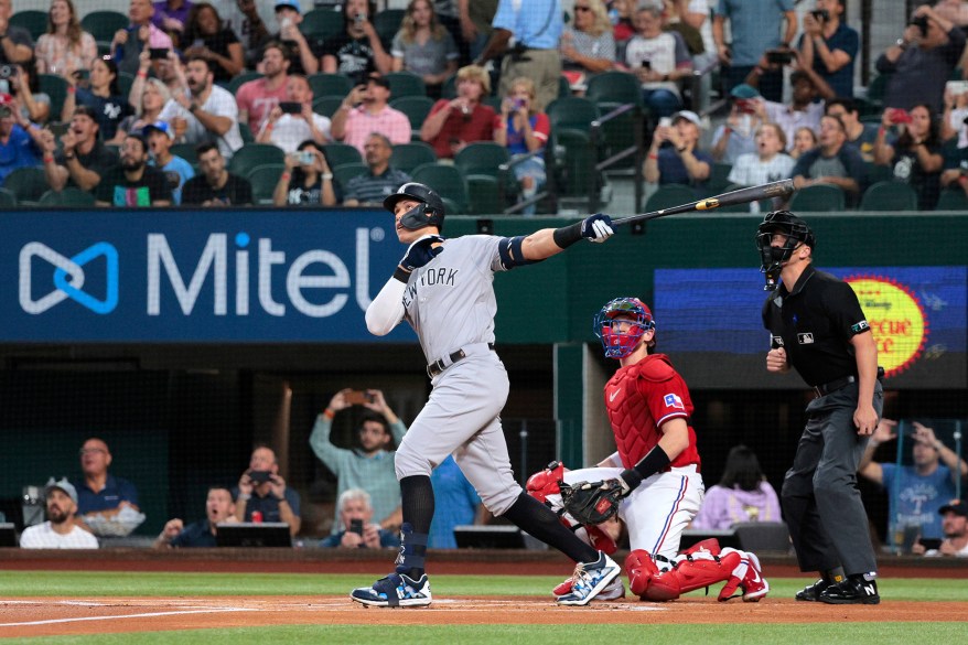 Aaron Judge hits his record-breaking 62nd home run of the season in the first inning during Game 2 of a doubleheader against the Rangers in Arlington, Texas on Oct. 4, 2022.