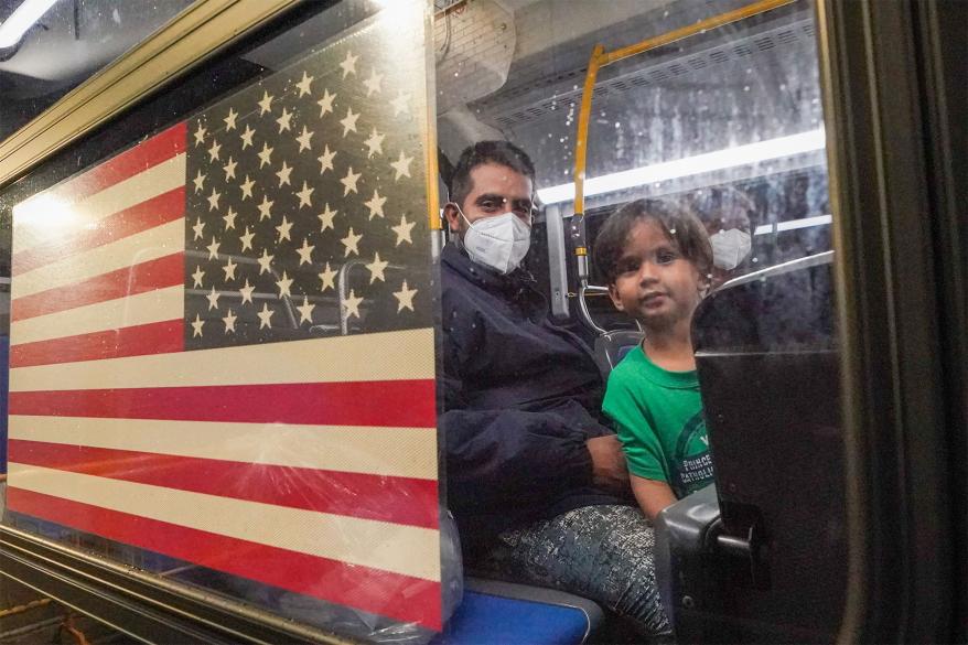 A picture of a migrant family heading towards Path Intake Center in the Bronx.