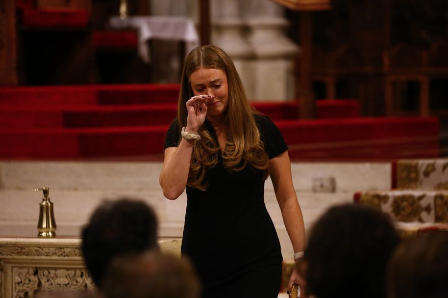 Melanie McGuirk spoke about her father during the service.