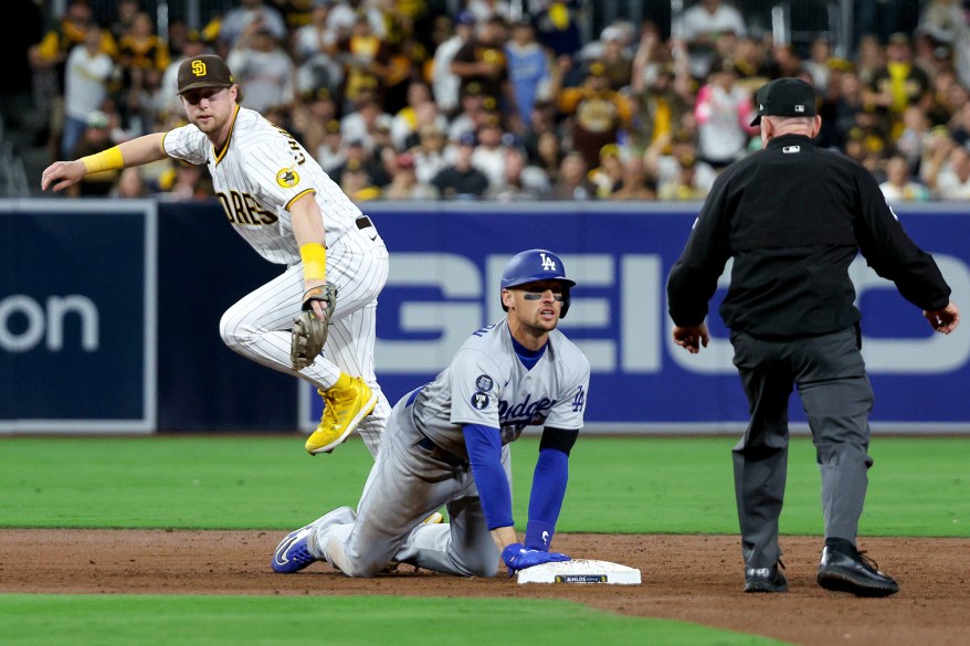 The Los Angeles Dodgers' Trayce Thompson looks toward the umpire after sliding into second base during NLDS Game 3 on Oct. 14, 2022 in San Diego, California.