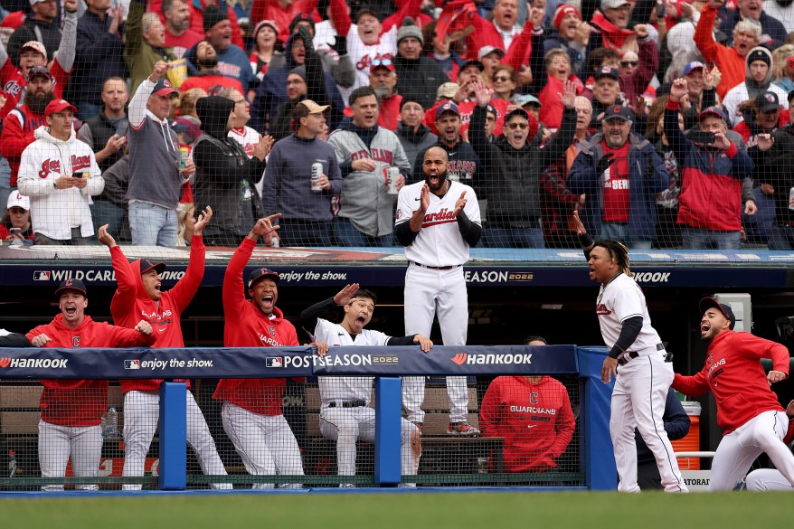 The Cleveland Guardians bench rejoices after Jose Ramirez hit a two-run home run in the sixth inning against the Tampa Bay Rays during Game 1 of the Wild Card Series on Oct. 7, 2022 in Cleveland.