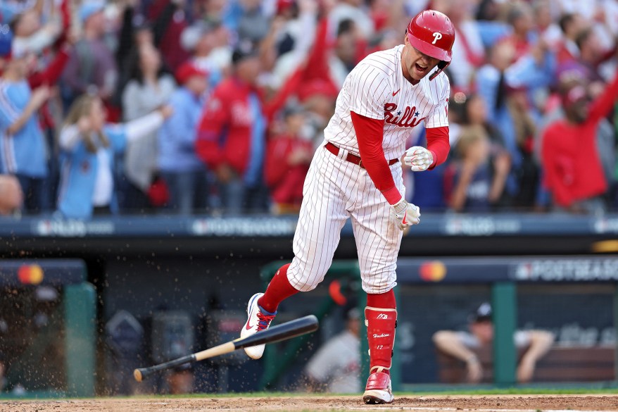 The Philadelphia Phillies' Rhys Hoskins spikes his bat after hitting a two run home run during the third inning NLDS Game 3 on Oct. 14, 2022 in Philadelphia.