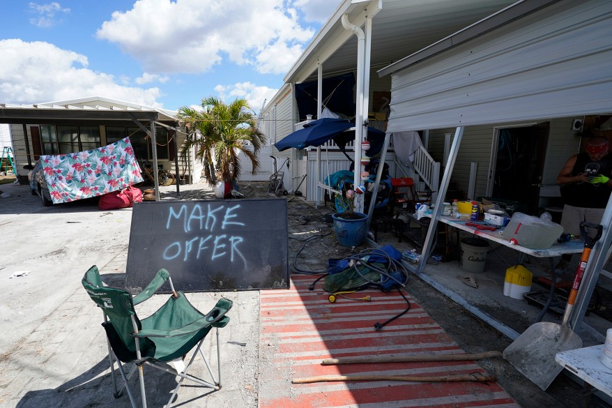 A sign, put up by an owner of a mobile home damaged in Hurricane Ian in Pine Island, Florida.