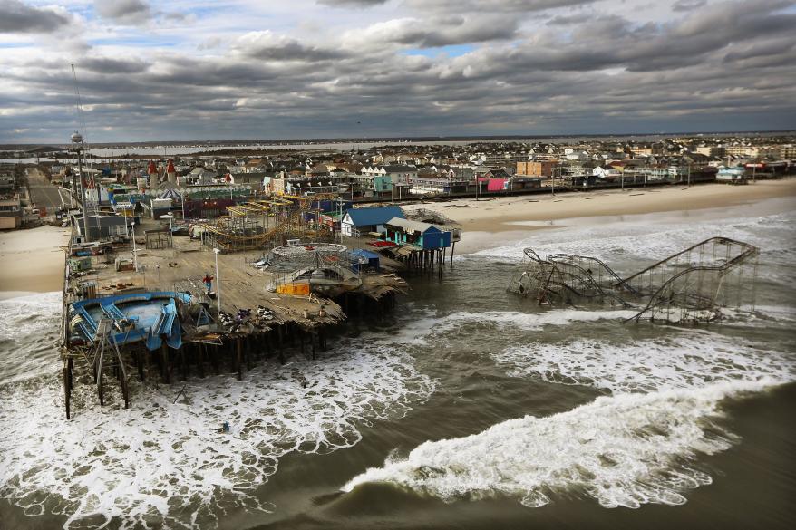 Waves break in front of a destroyed amusement park wrecked by Hurricane Sandy on Oct. 31, 2012.