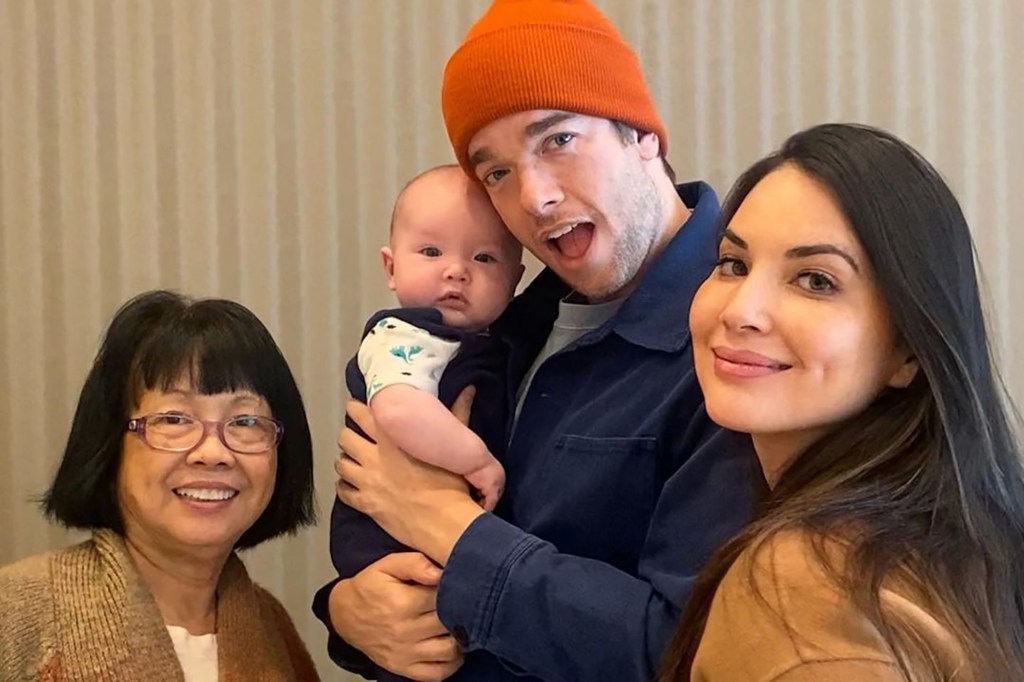 Munn and Mulaney with their son Malcolm and her mother. Their relationship caused many online commenters to literally wish the couple harm. 