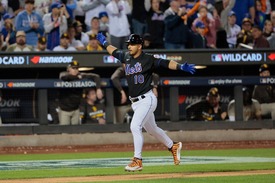 The New York Mets' Eduardo Escobar celebrates after hitting a home run in Game 1 of the NL Wild Card Series against the San Diego Padres on Oct. 7, 2022 in Flushing.