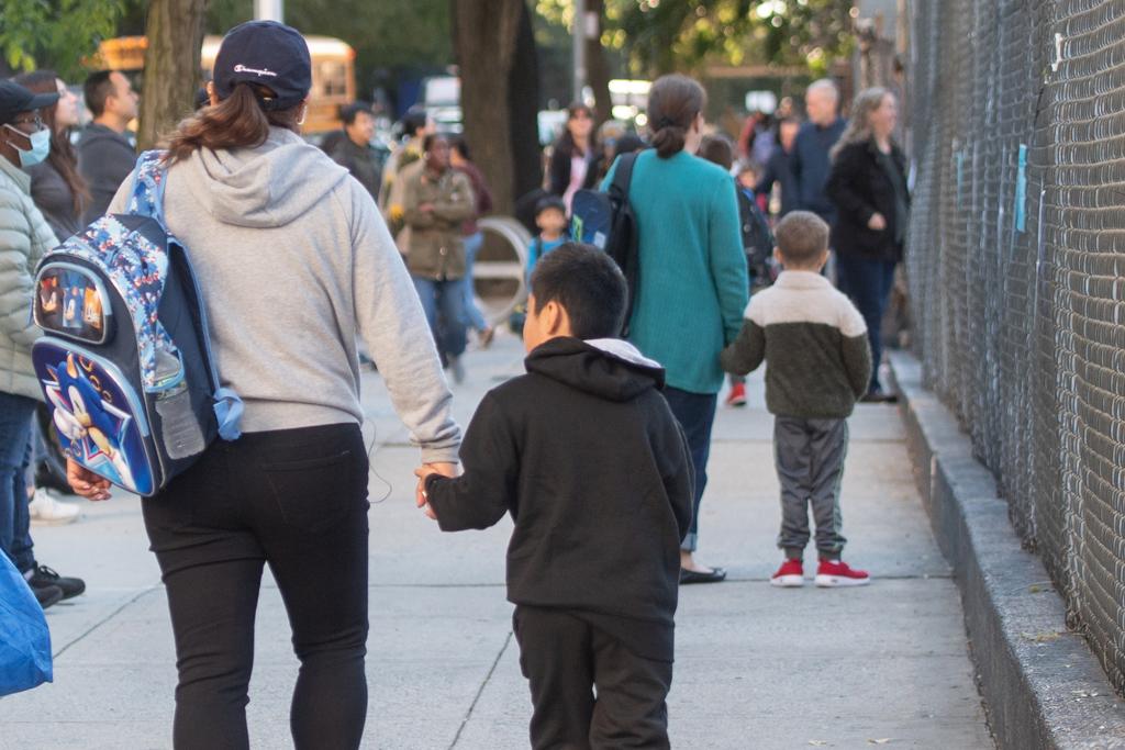 Students and parents ourtside P.S. 111 Adolph S. Ochs School and City Knoll Middle School, 440 West 53 Street,