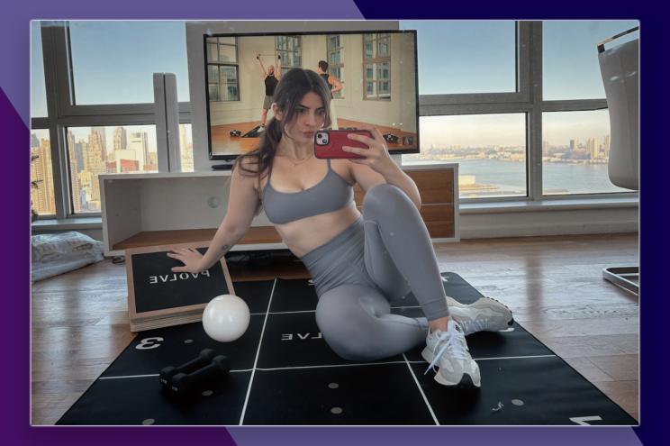 Miska Salemann sitting on a Pvolve mat taking a selfie.