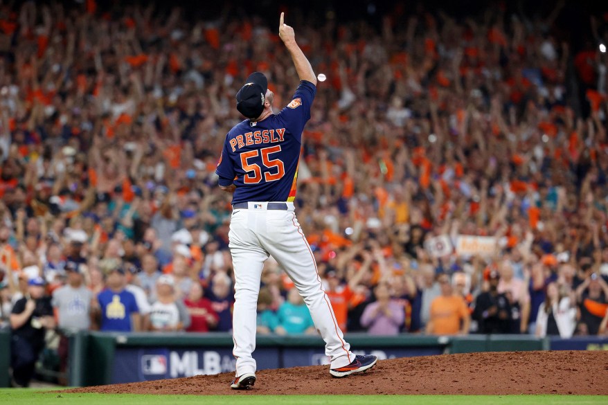 The Houston Astros' Ryan Pressly rejoices after the final out against the Seattle Mariners in ALDS Game 2 on Oct. 13, 2022 in Houston.