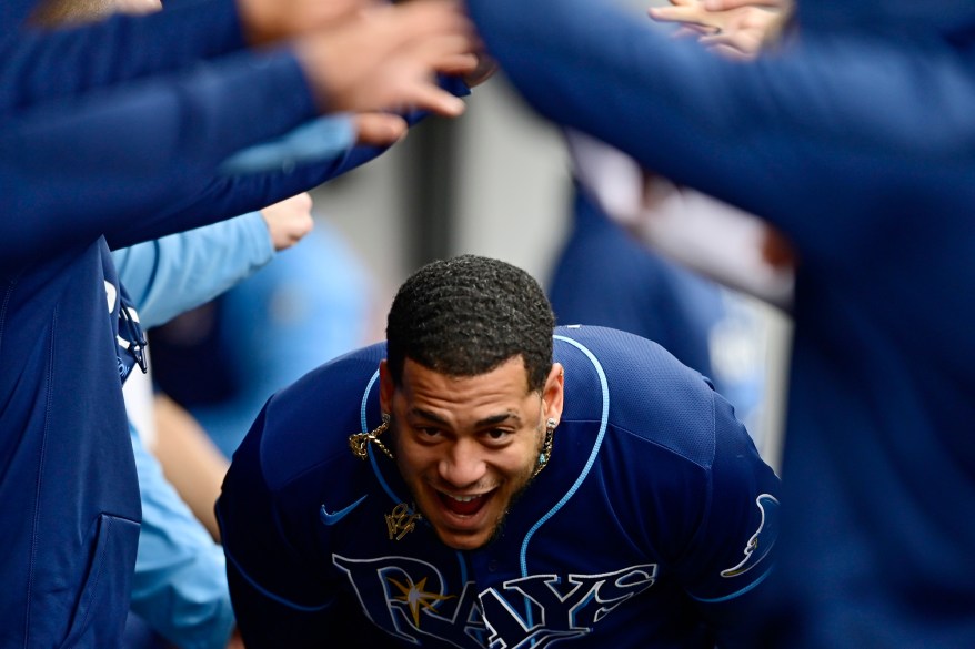 The Tampa Bay Rays' Jose Siri celebrates in the dugout after a solo home run in the sixth inning of a wild card baseball playoff game against the Cleveland Guardians on Oct. 7, 2022 in Cleveland.