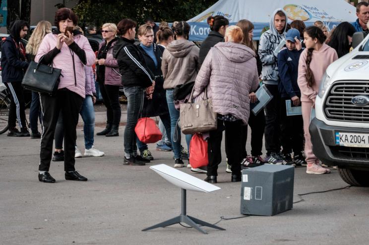 Russia is mulling targeting Western satellites for helping Ukraine in its war effort. Pictured: A Starlink satellite-based broadband system is seen at a mobile passport application station in the Kharkiv region.