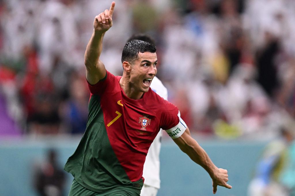 Portugal's forward #07 Cristiano Ronaldo celebrates scoring his team's first goal during the Qatar 2022 World Cup Group H football match between Portugal and Uruguay at the Lusail Stadium in Lusail, north of Doha on November 28, 2022.