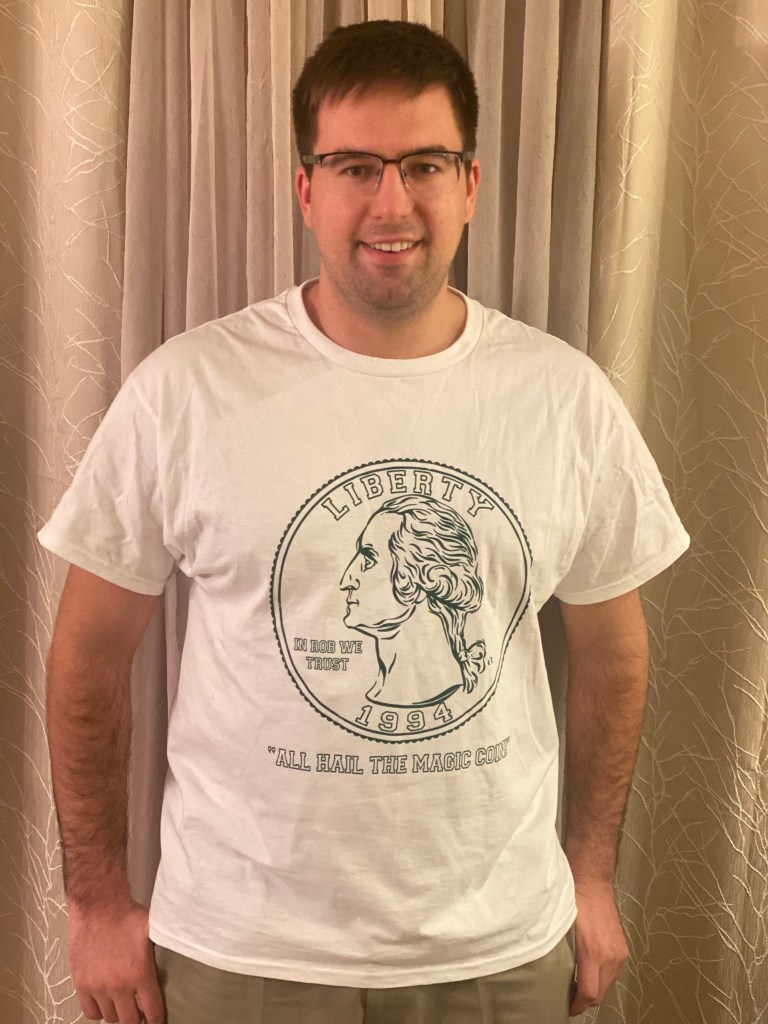 Alex Noon began selling t shirts about his prophecy coin flips. 