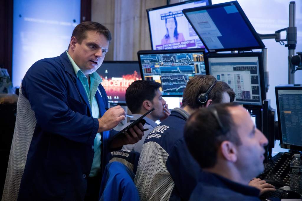 Traders work on the floor of the New York Stock Exchange