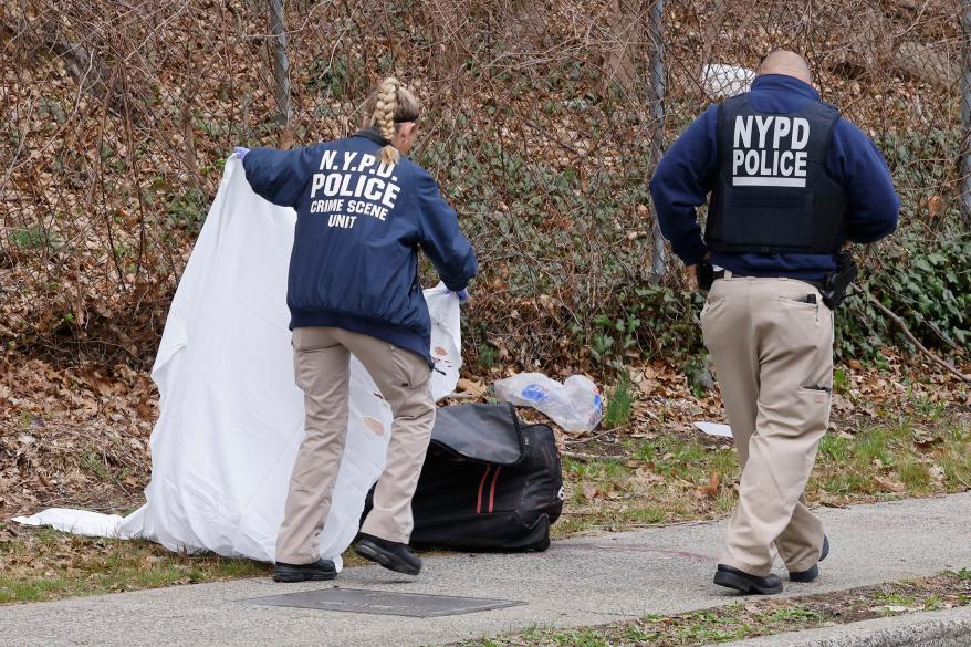 Police investigate Gaal's body, which was found on the sidewalk.