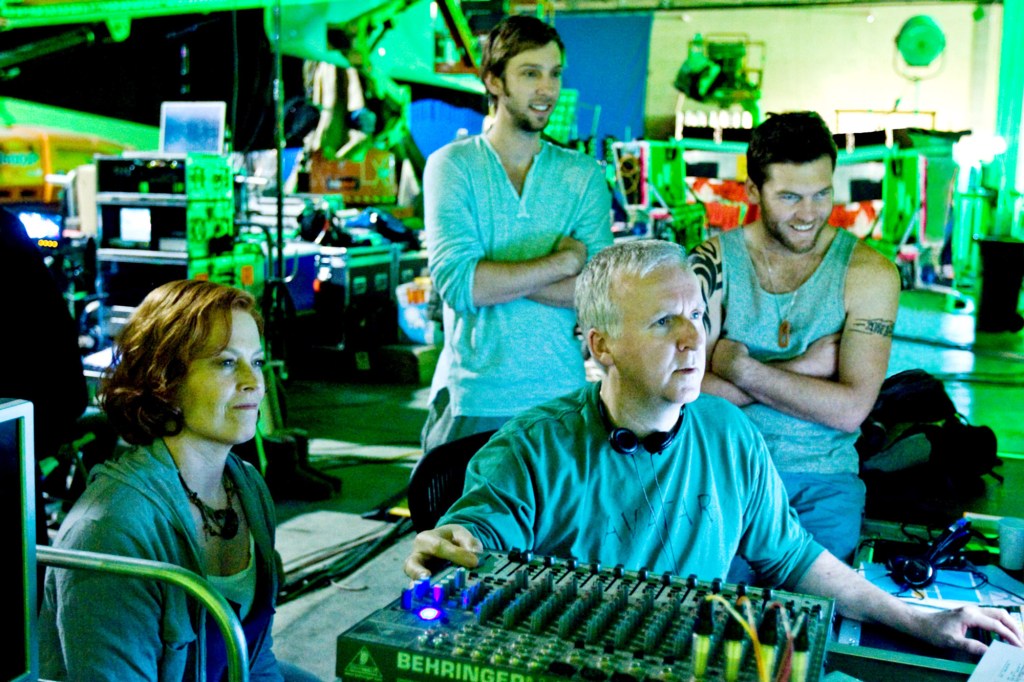 AVATAR, from left: Sigourney Weaver, Joel Moore, director James Cameron, Sam Worthington, on set, 2009, ph: Mark Fellman/TM & Copyright ©20th Century Fox. All rights reserved/Courtesy Everett Collection  Film Still