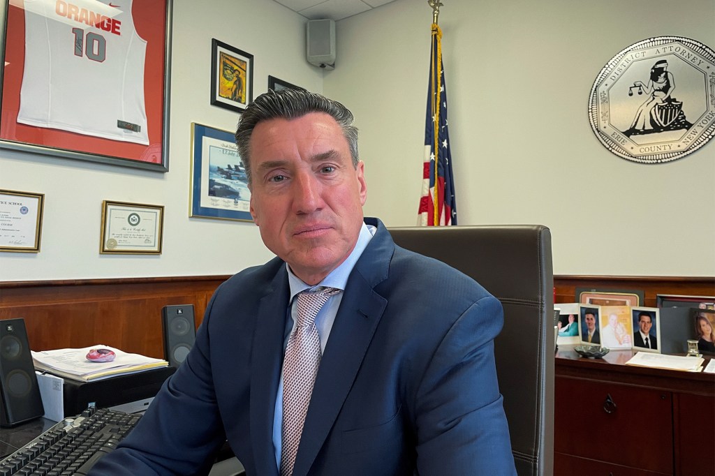 Erie County District Attorney John Flynn poses at his office after an interview.