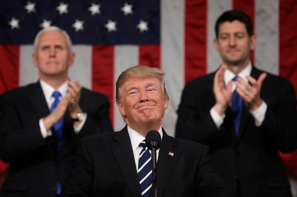 President Donald Trump addresses a joint session of Congress on Capitol Hill in Washington, as Vice President Mike Pence and House Speaker Paul Ryan of Wis., applaud