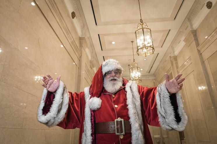 Dana "Santa" Friedman, dressed as Santa Claus at his office