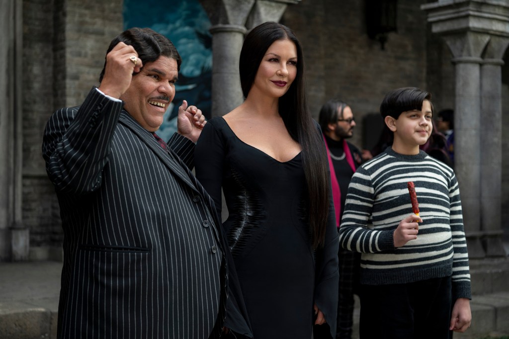 Wednesday. (L to R) Luis Guzmán as Gomez Addams, Catherine Zeta-Jones as Morticia Addams, Issac Ordonez as Pugsley Addams in episode 105 of Wednesday. Cr.  © 2022