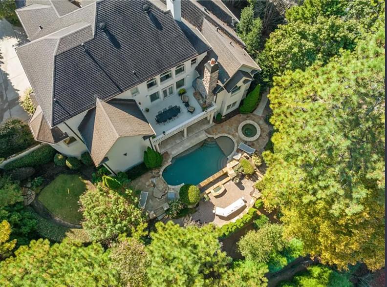 The sprawling backyard with an in-ground pool.