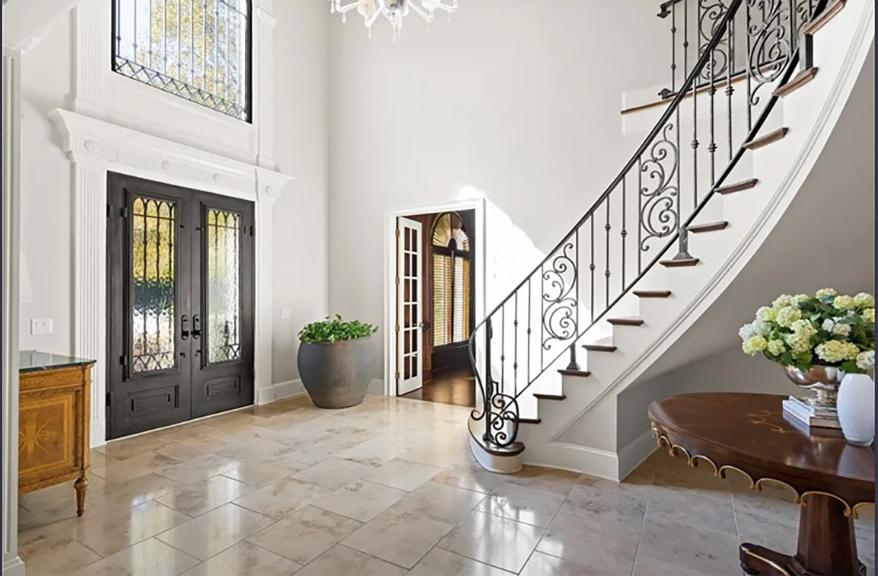 The entry way with cathedral-esque ceilings.