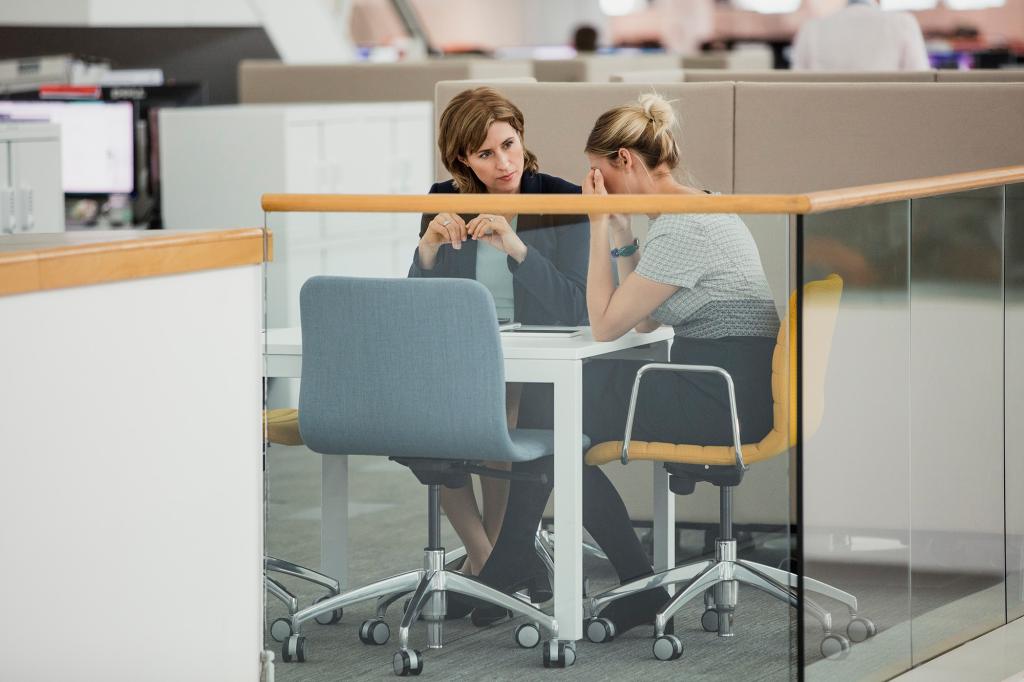 Women at desk talking