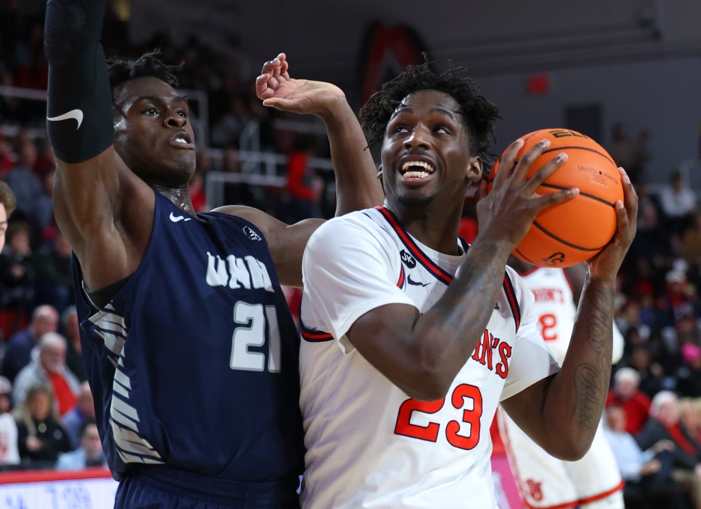 David Jones (23) of the St. John's Red Storm drives to the basket as Clarence O. Daniels II (21) of the New Hampshire Wildcats defends during the first half when the St. John's Red Storm played the New Hampshire Wildcats Saturday, December 10, 2022 at St. John's University in Queens, NY. 