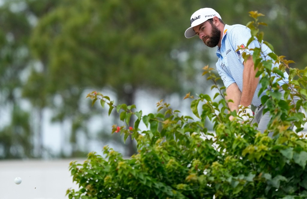 Cameron Young chips onto the third green during the first round of the Hero Word Challenge.