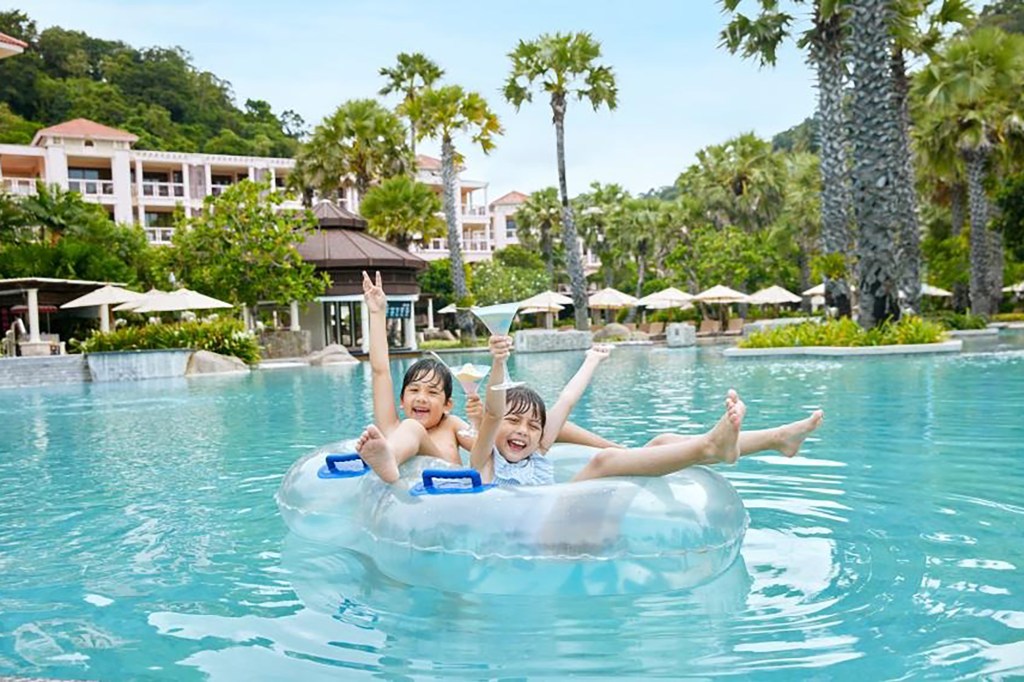 Two kids in a hotel pool