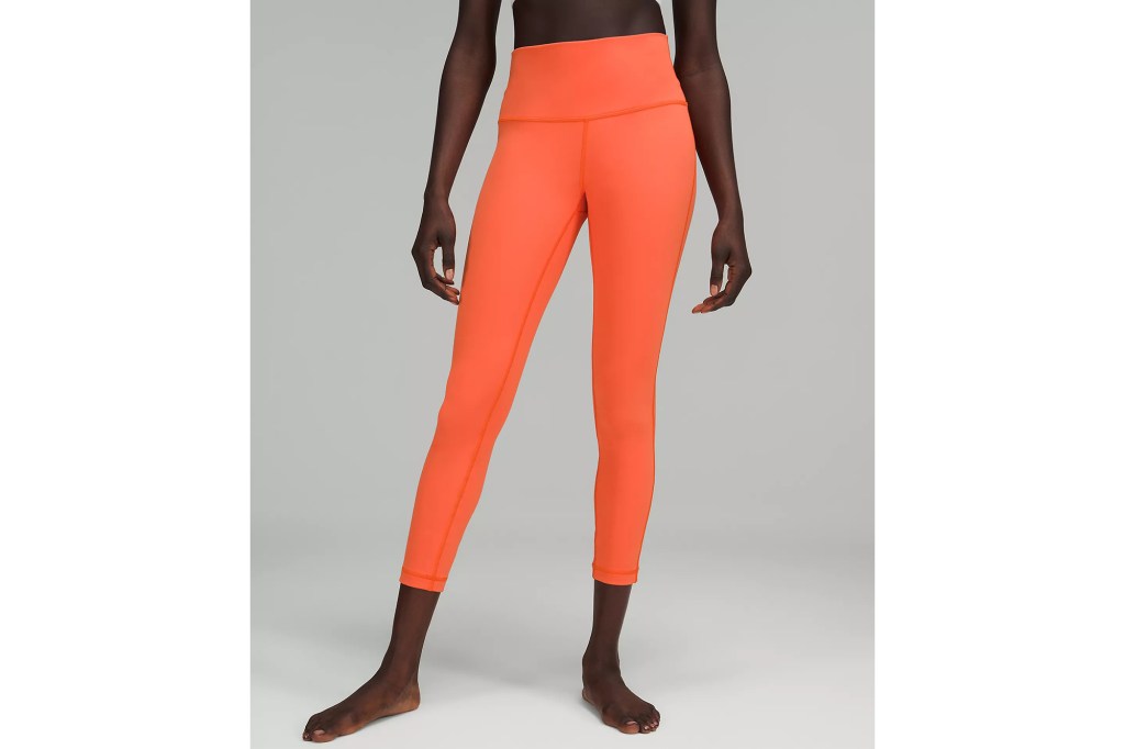 A woman in orange leggings 