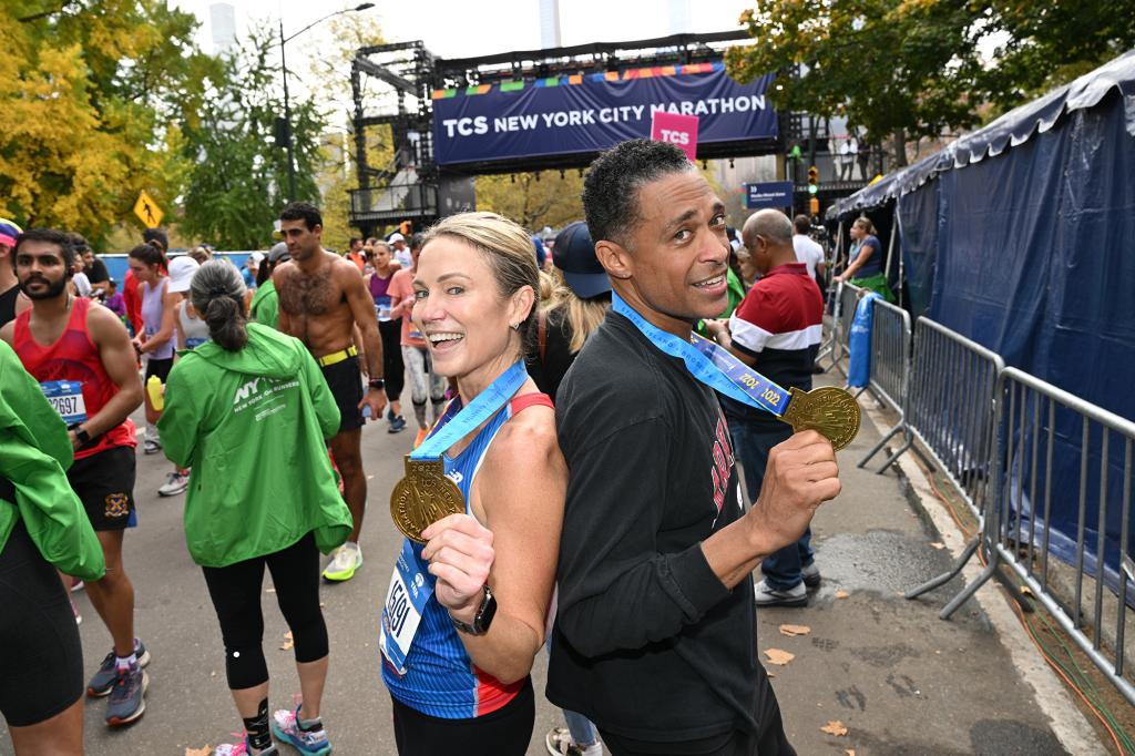 Amy Robach and TJ Holmes run during the 2022 TCS New York City Marathon on November 06, 2022 in New York City. (Photo by Bryan Bedder/New York Road Runners via Getty Images)