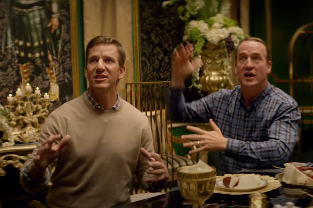 Eli Manning and Peyton Manning appear in an advertisement for Caesars Sportsbook.