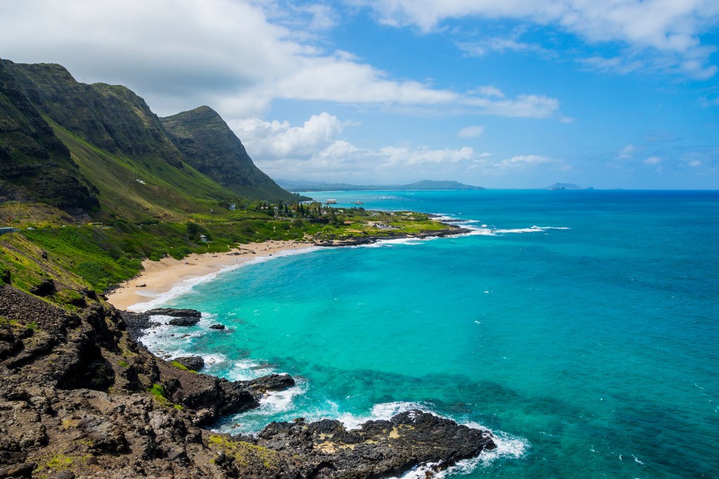 Rocky shoreline and pocket beach at Makapuʻu Point, western end of Oahu, Hawaii