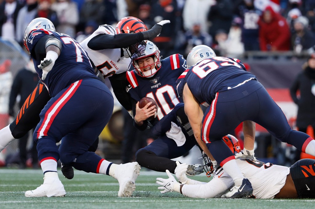 Patriots quarterback Mac Jones (10) is sacked during a loss to the Bengals on Dec. 24, 2022.