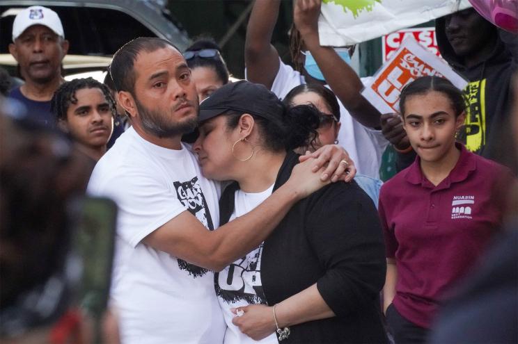 Mother and father attend anti gun rally held for their daughter, Kyhara Tay.