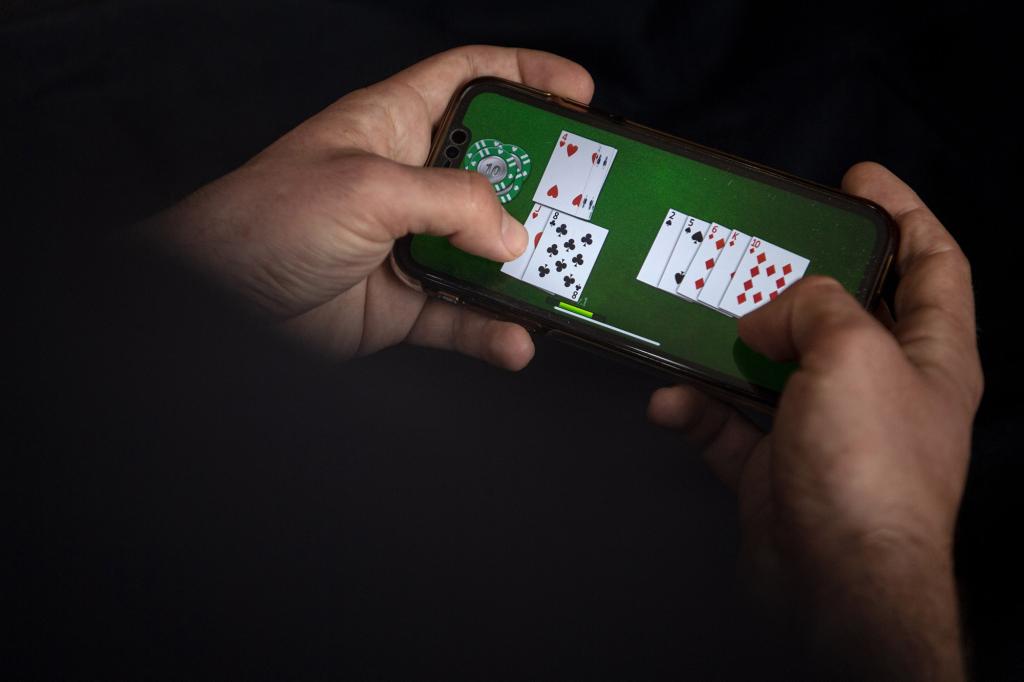 An online card game is played on a smartphone.