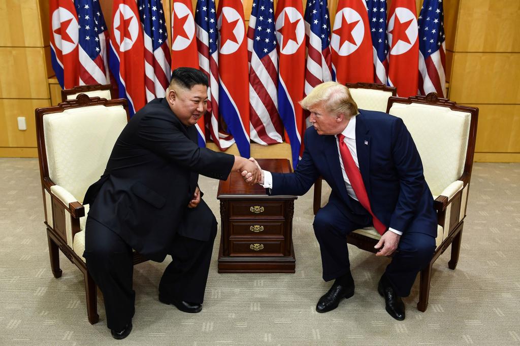 Then-President Donald Trump and Kim Jong Un greet each other during their summit on June 30, 2019, in South Korea.