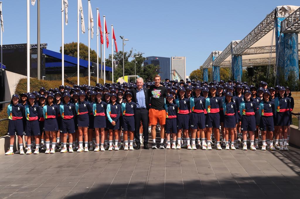 Craig Tiley, the CEO of Tennis Australia, with Canadian Denis Shapavalov, and the 2023 Australian Open ballkids.