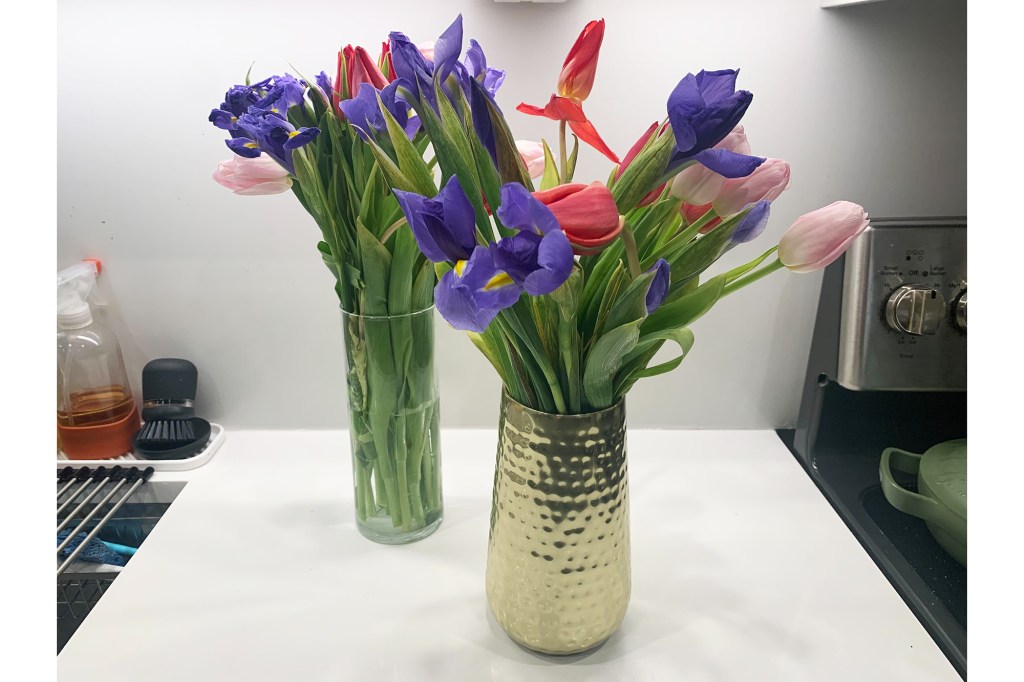 Two vases of pink and purple flowers