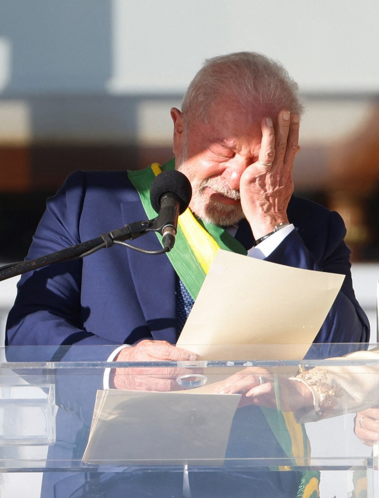 Brazil's President Luiz Inacio Lula da Silva wipes tears as he speaks at the Planalto Palace in Brasilia, Brazil on Jan. 1, 2023. 