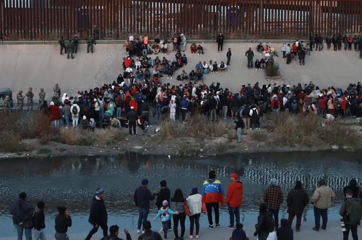 Migrants gather at a crossing into El Paso, Texas.