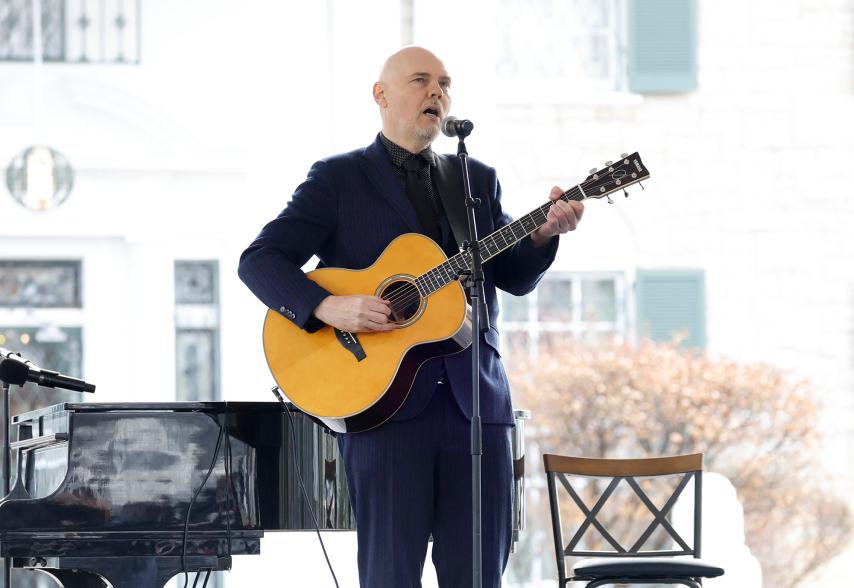 Billy Corgan of the Smashing Pumpkins performs at the memorial service.