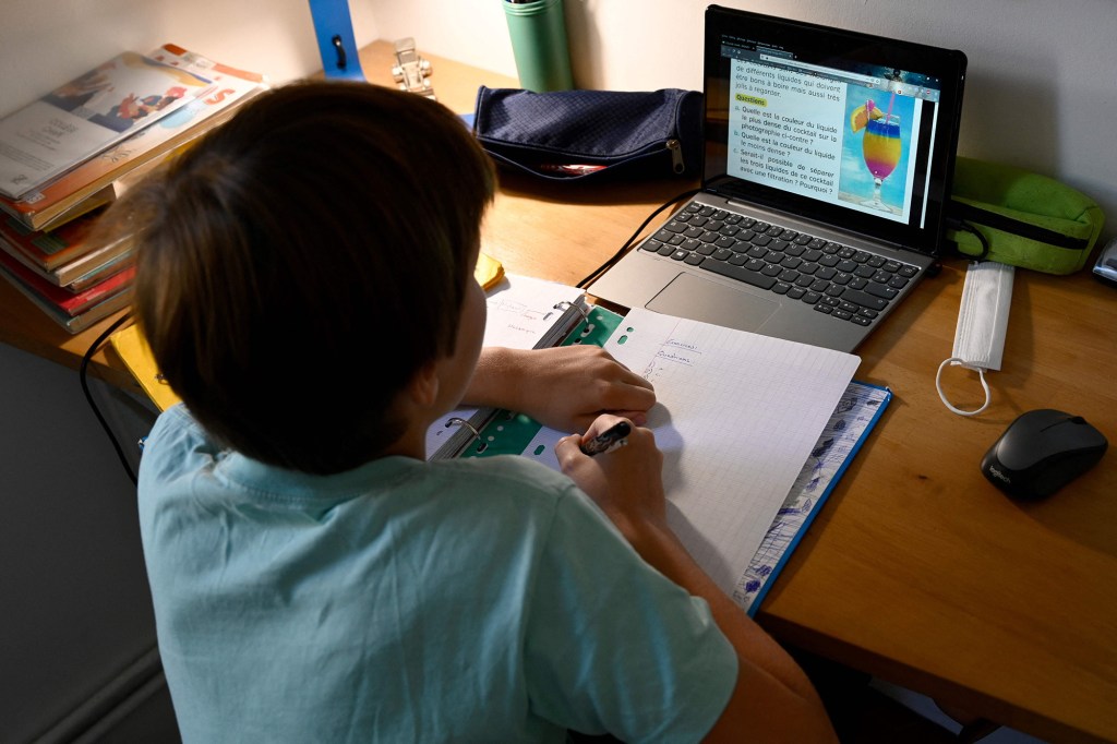 Student working on laptop.