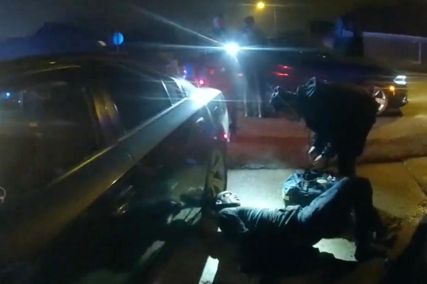 Nichols is seen propped up against a police car after the beating.