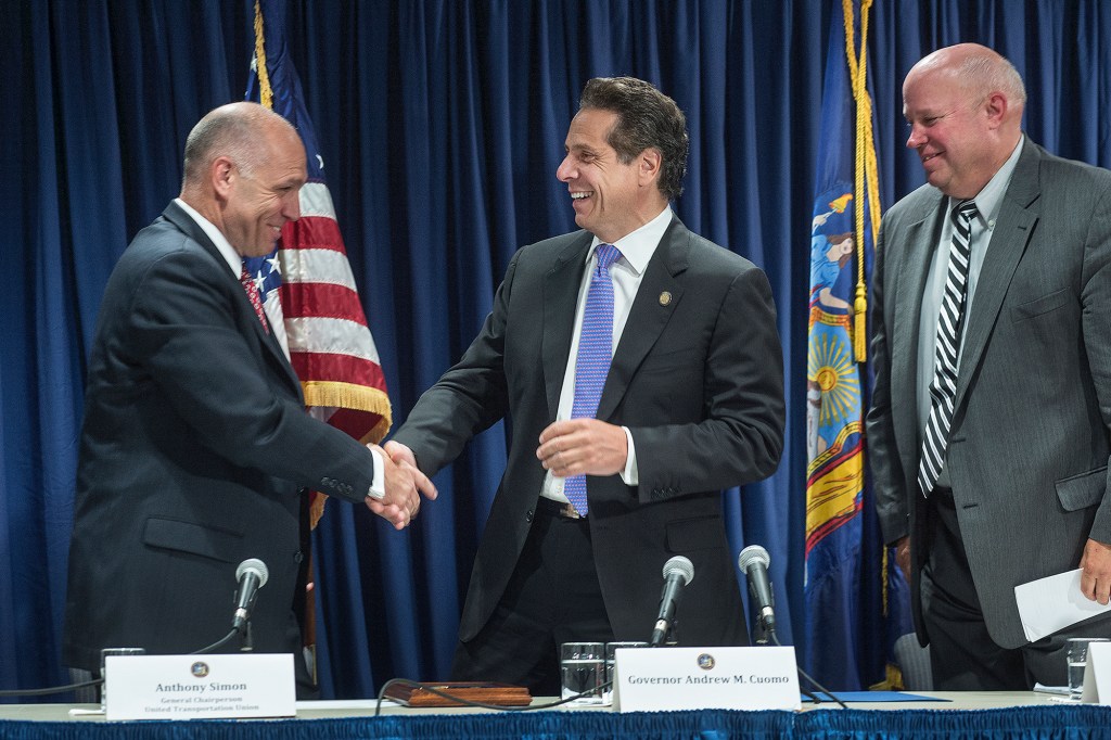 Then-Gov. Andrew Cuomo shakes hands with union chief Anthony Simon.