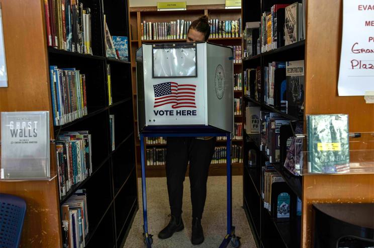 A voter casts their ballot on November 8, 2022 at the Brooklyn Public Library.