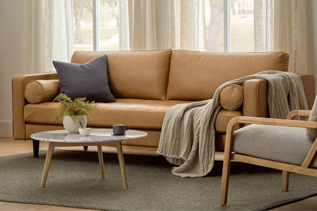 Brown couch with gray fabric chair