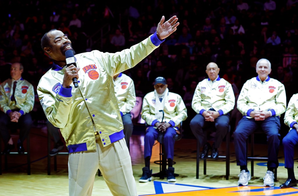 Walt "Clyde" Frazier addresses Knicks fans during a ceremony honoring their 1973 championship team.