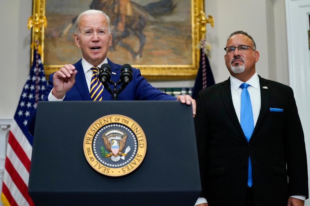 President Biden, along with Education Secretary Miguel Cardona, announce a plan to forgive billions of dollars in student loan debt at the White House in August 2022.